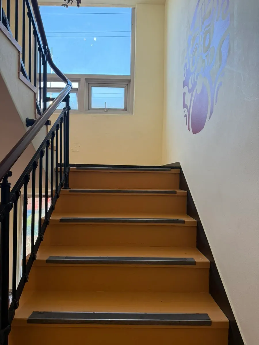 Stairs leading up to the 2nd-floor restaurant
