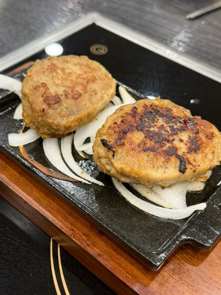 Tteokgalbi steak served on a hot stone plate