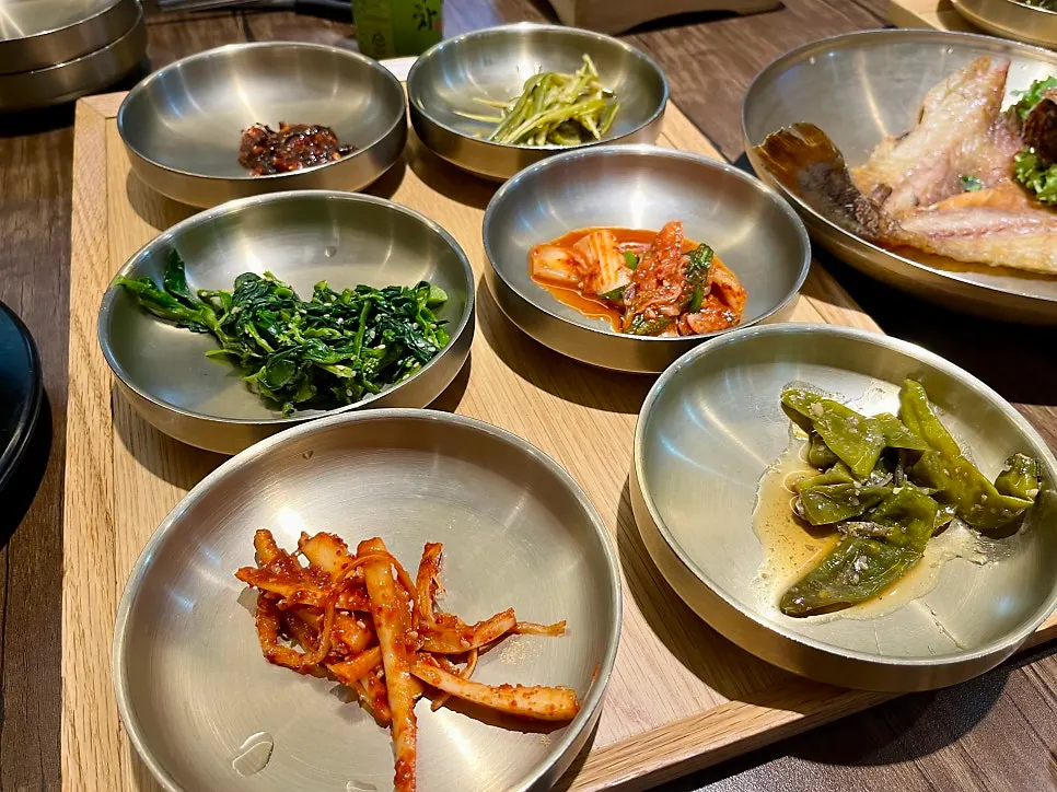 Side dishes in individual brass bowls