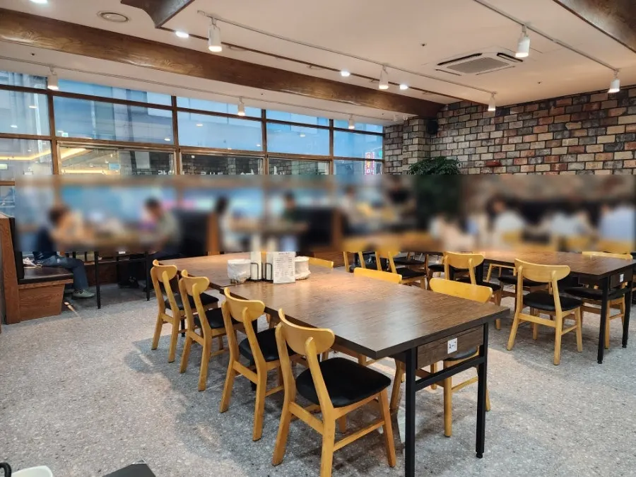 Spacious hall and tables inside the Korean restaurant