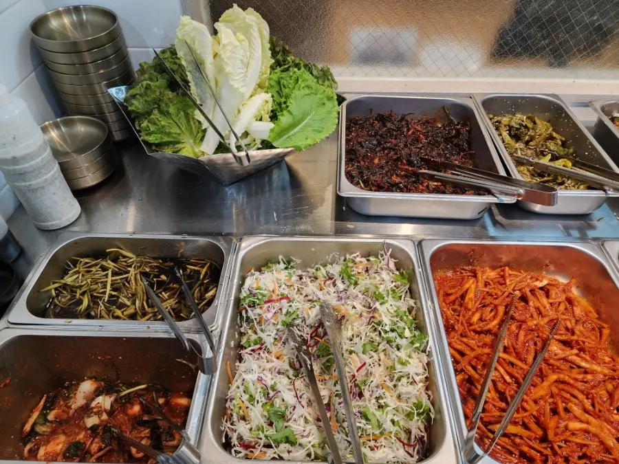 Self-bar side dishes like ssam vegetables and fried lotus root