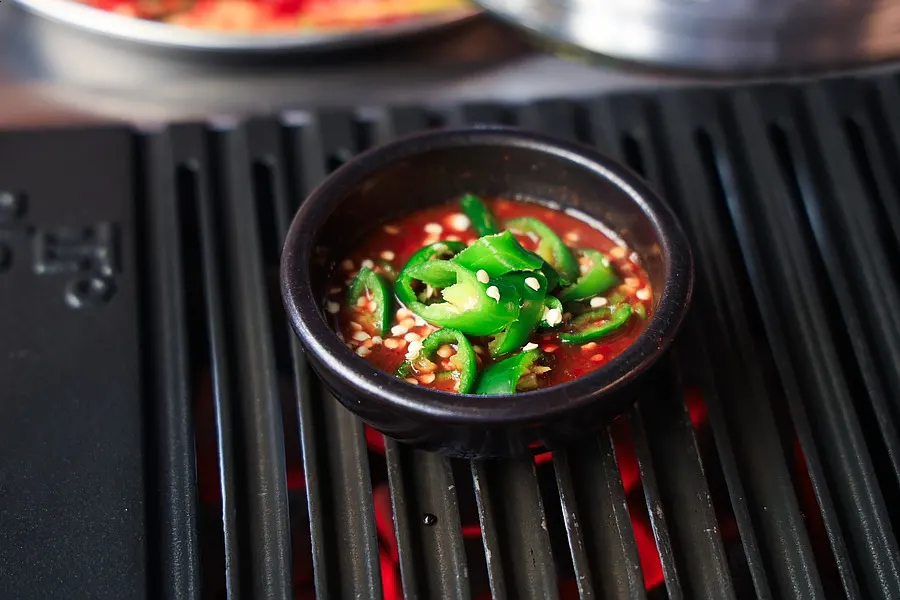 Meat grilling on an aluminum grill