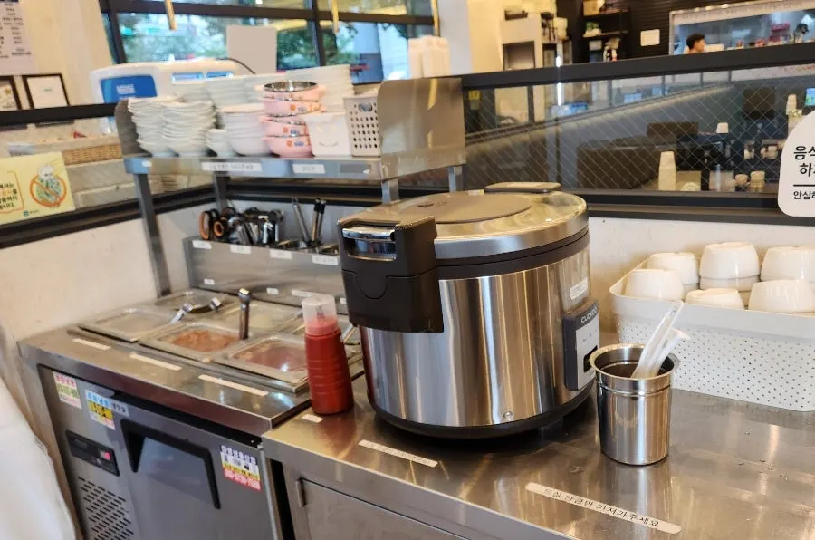 Self-bar stocked with rice and side dishes