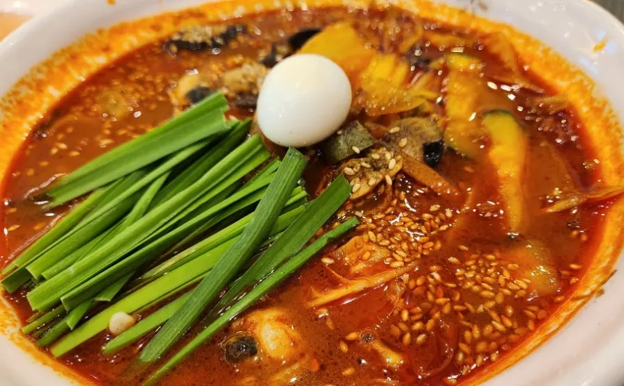 Close-up of the red broth in the seafood jjamppong