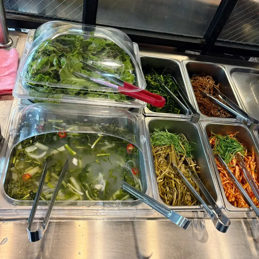 Side dishes including japchae and fried eggplant