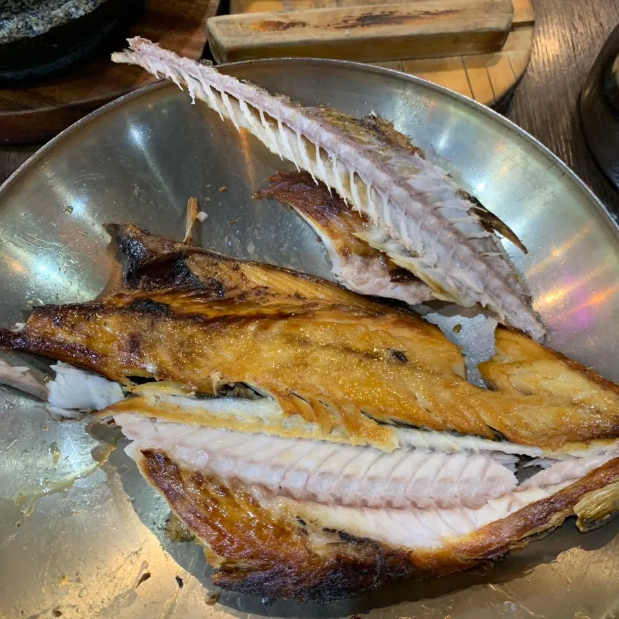 Korean table set with added grilled mackerel