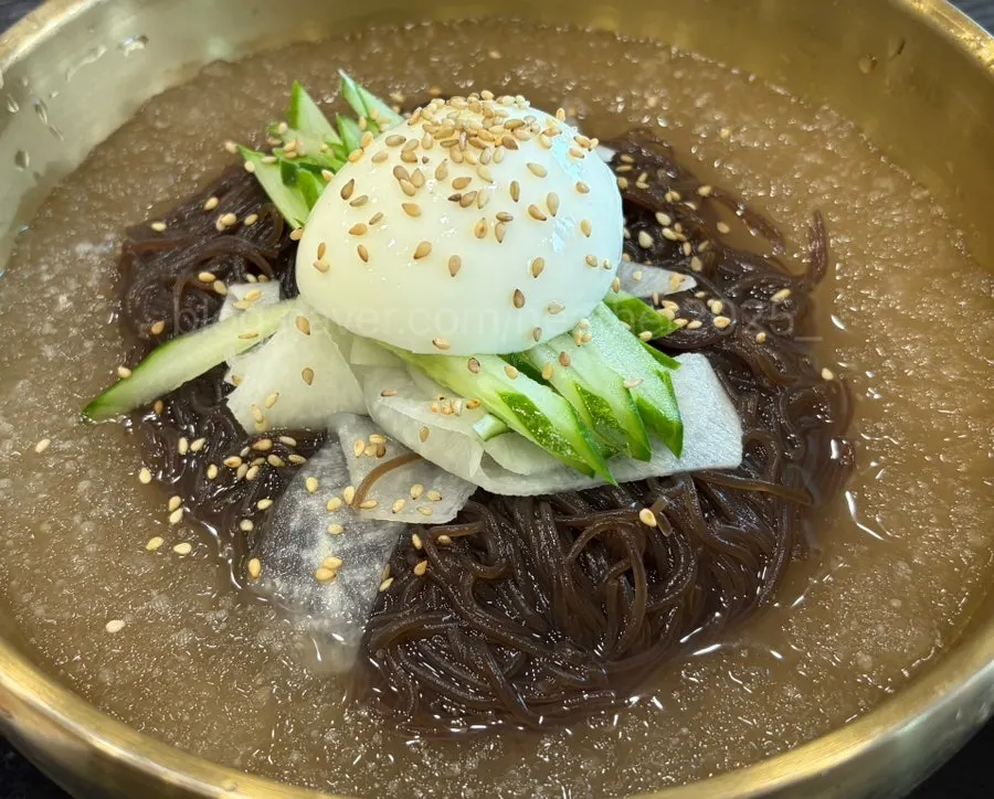 Mul-naengmyeon broth full of slushy ice with noodles