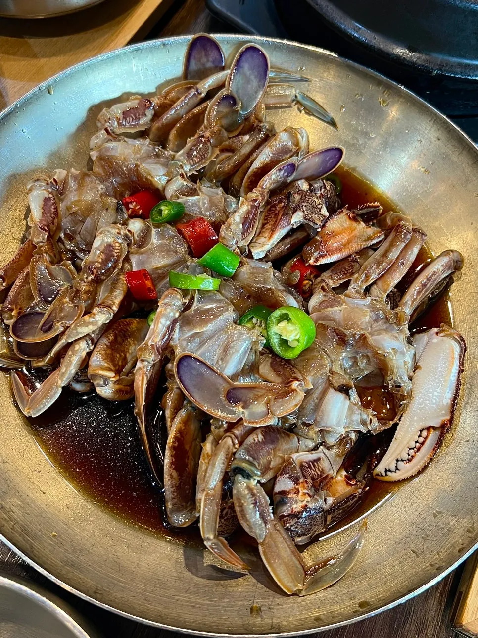 Soy-marinated crab side dish served in a large bowl