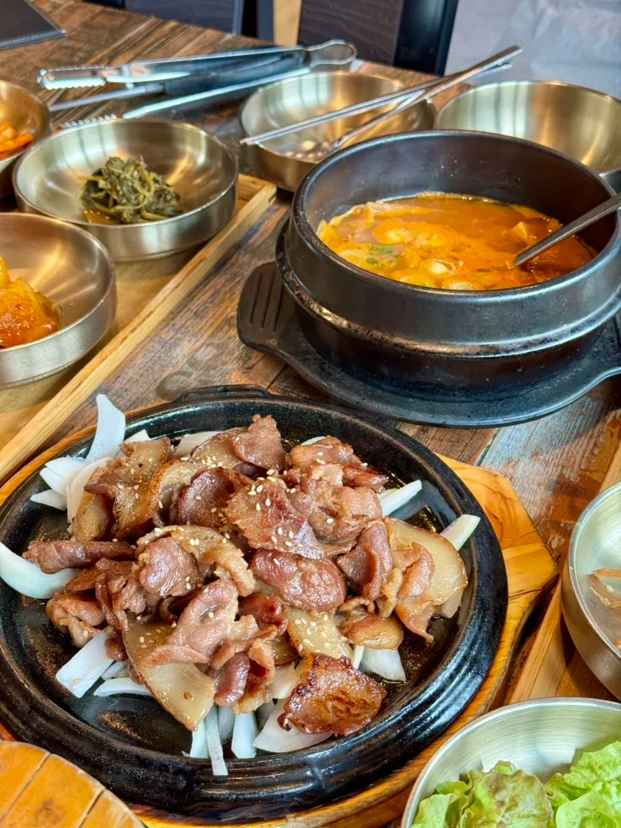 Table with cheonggukjang and rice set out
