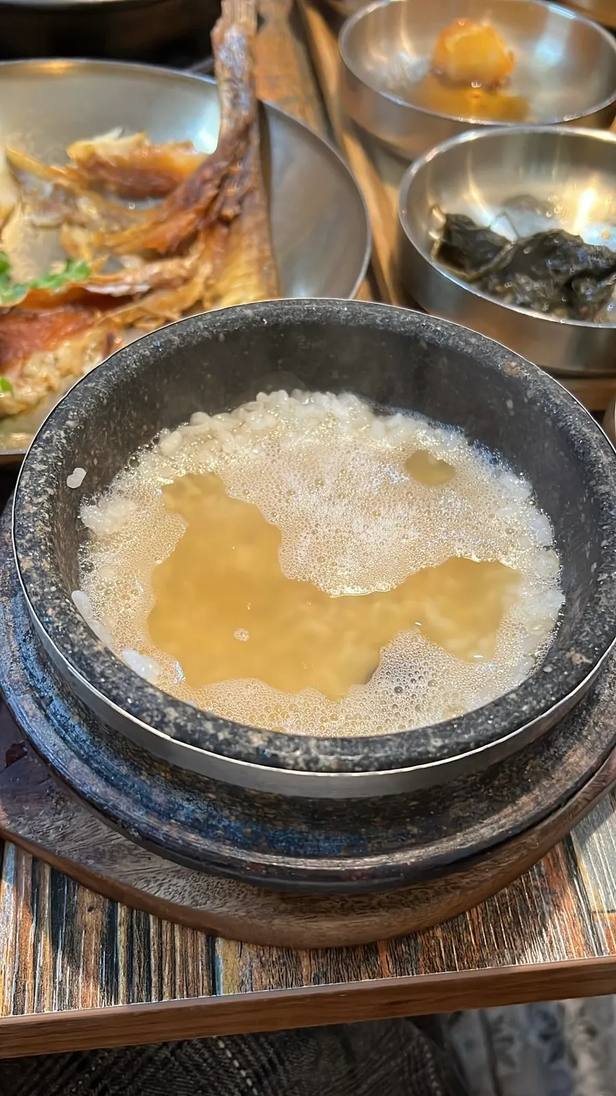 Warm pot rice topped with seasoned vegetables