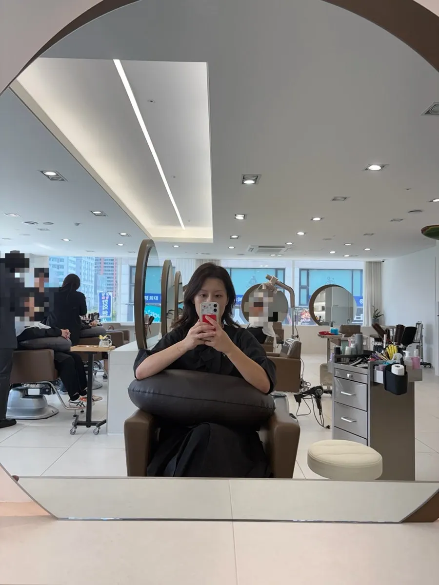Hair before treatment, with curls and frizz