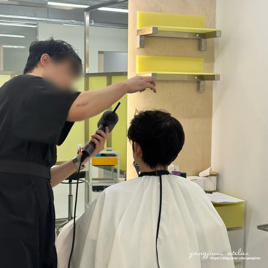 Husband getting the finishing cut