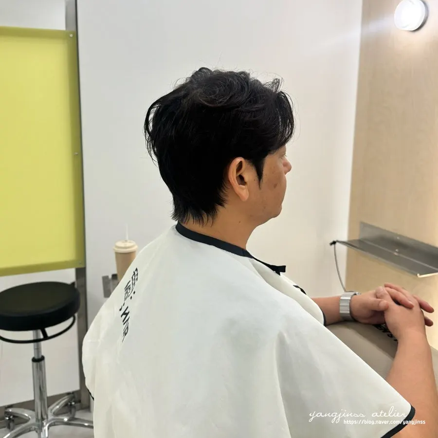 Neatly styled hair after the cut and down perm