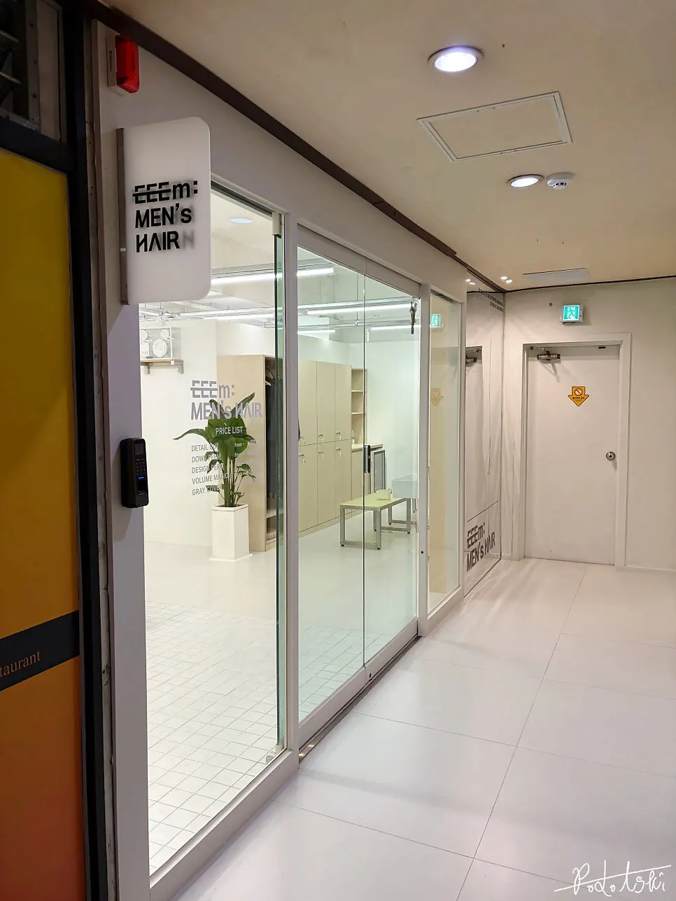 Exterior of the men's hair salon on the 3rd floor of the building