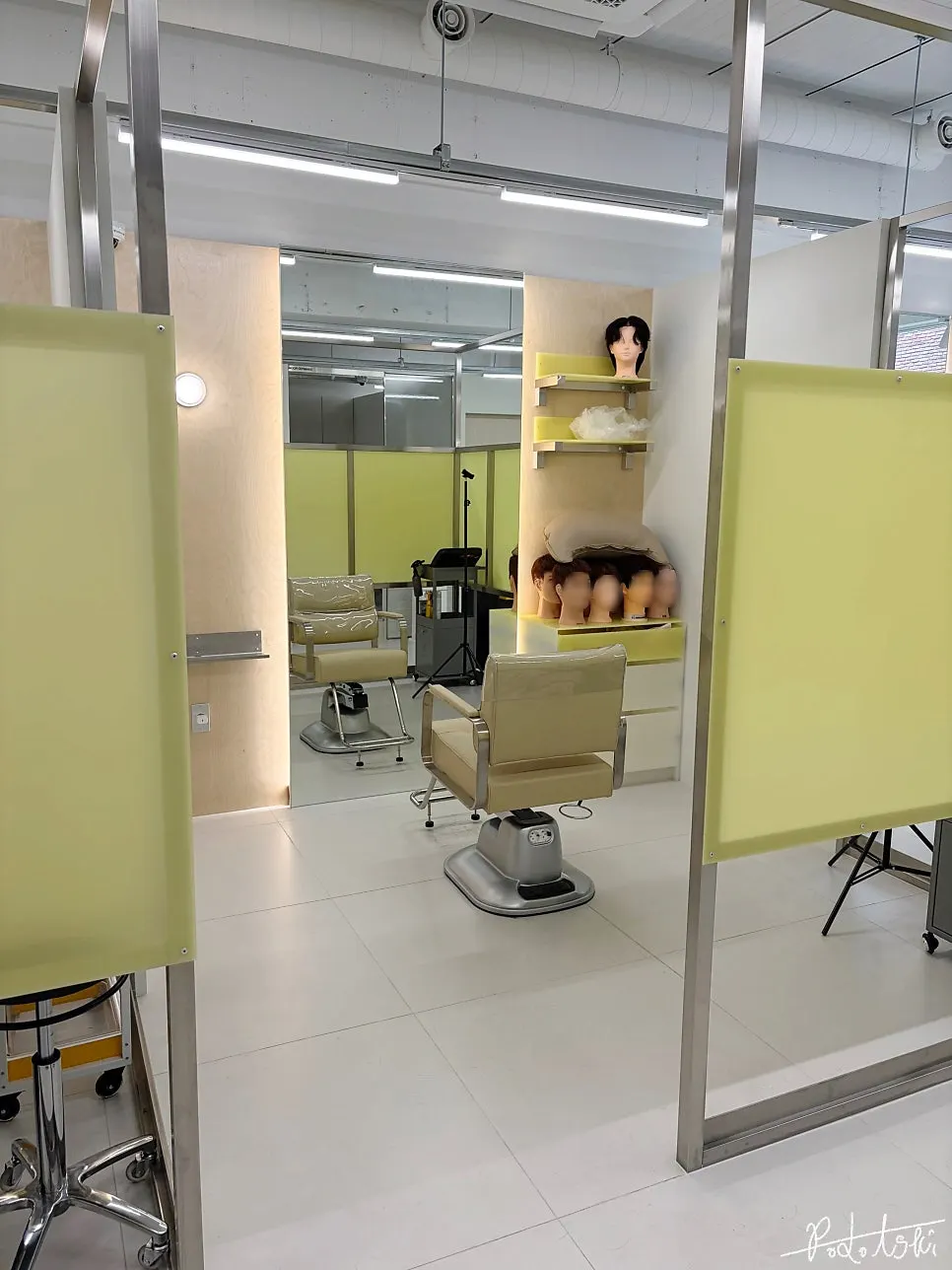 Partitioned styling chair at the men's salon