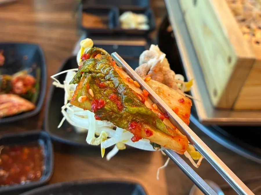 Duck meat dipped in peanut sauce and chili sauce
