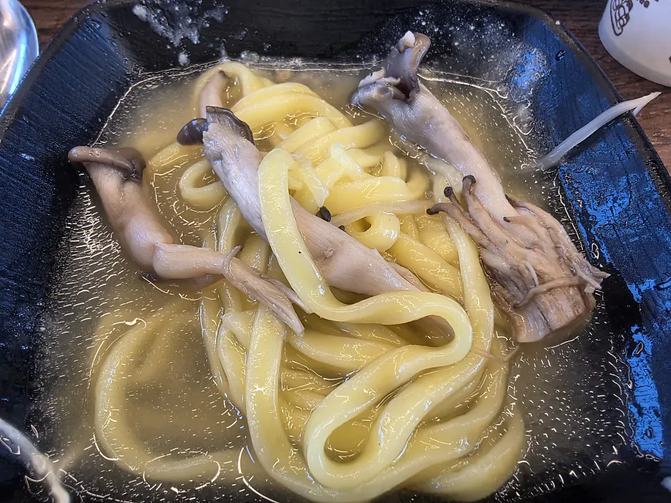 Mushroom noodles cooked in the steamed duck broth