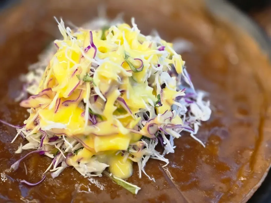 Side dish of acorn jelly pancake and salad