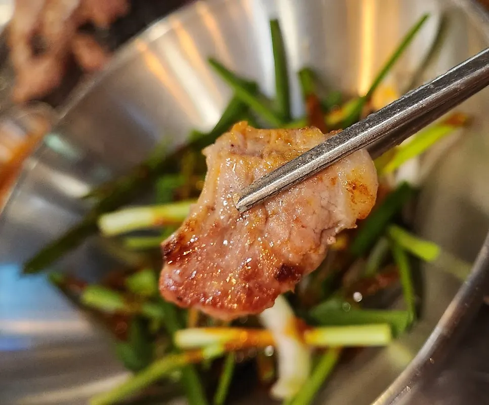 Iberico pork neck browning nicely on the grill