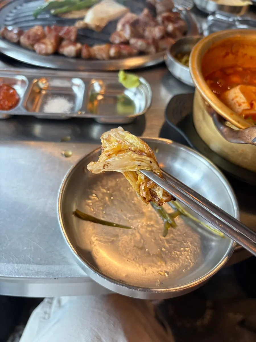 White kimchi and meat grilled on the barbecue