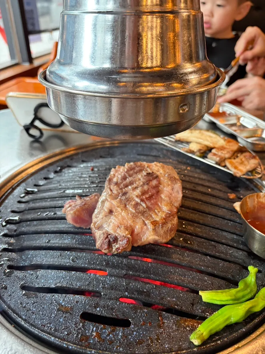 Extra pork neck being grilled