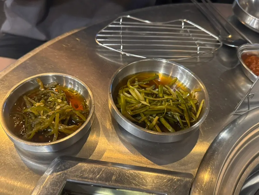 Meat served with hairtail jeotgal and pickled sides