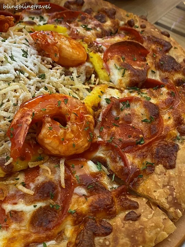 A slice of pastry pizza showing its layered crust