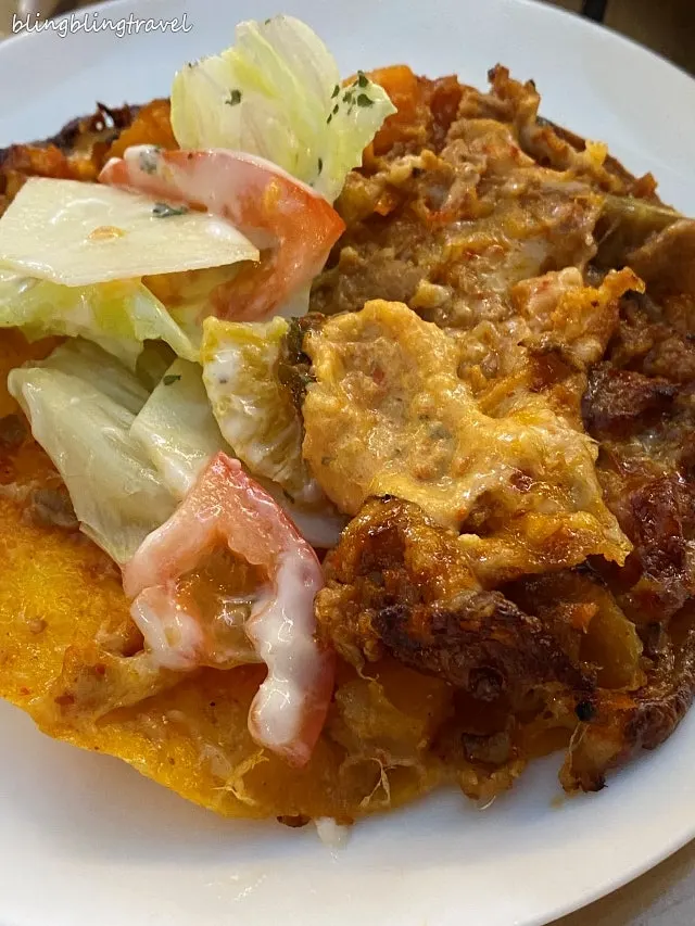 Taco shell filled with cheese and bulgogi