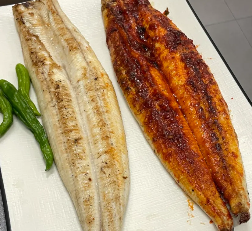 Picking up a piece of grilled eel
