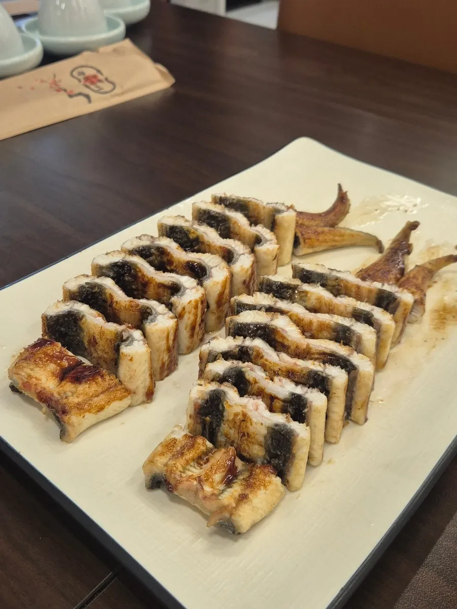 Freshwater eel coated in teriyaki-style sauce