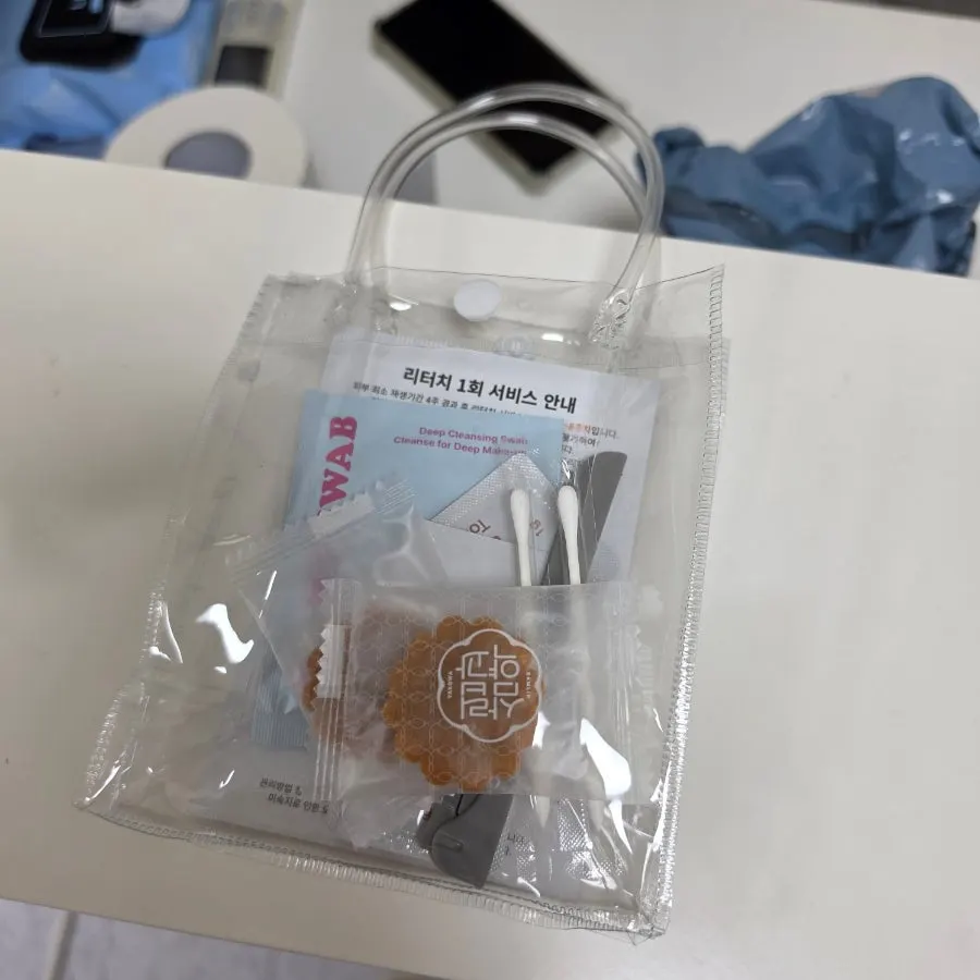 Aftercare items including an eyebrow razor and recovery cream
