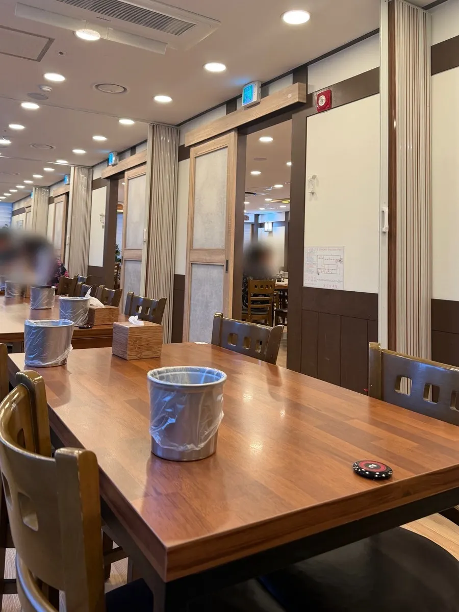 View of the dining hall with many tables