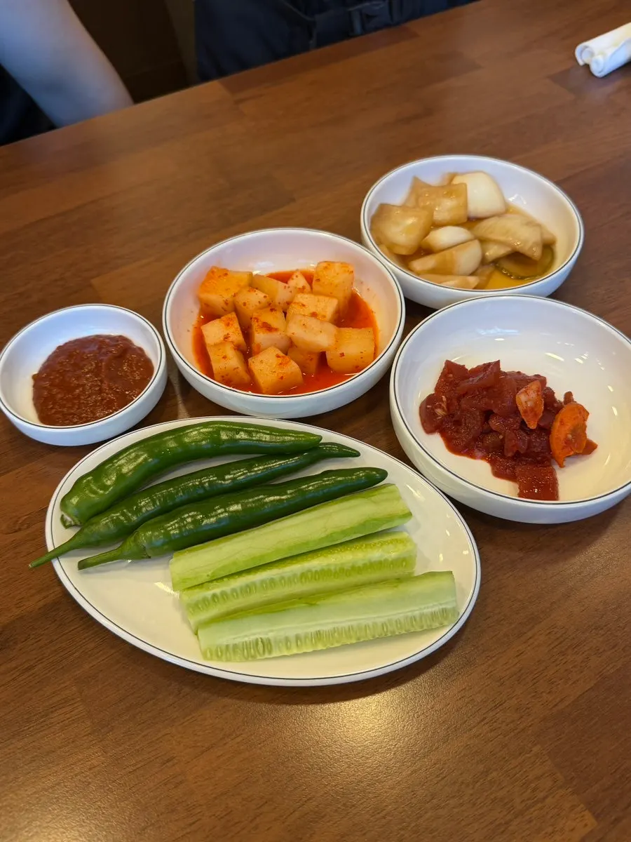 Full table setting with samgyetang and basic side dishes