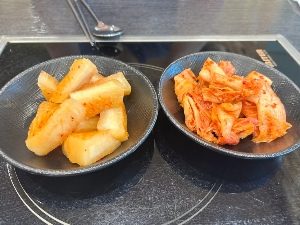 Self-service bar with scallions, salt, and extra rice