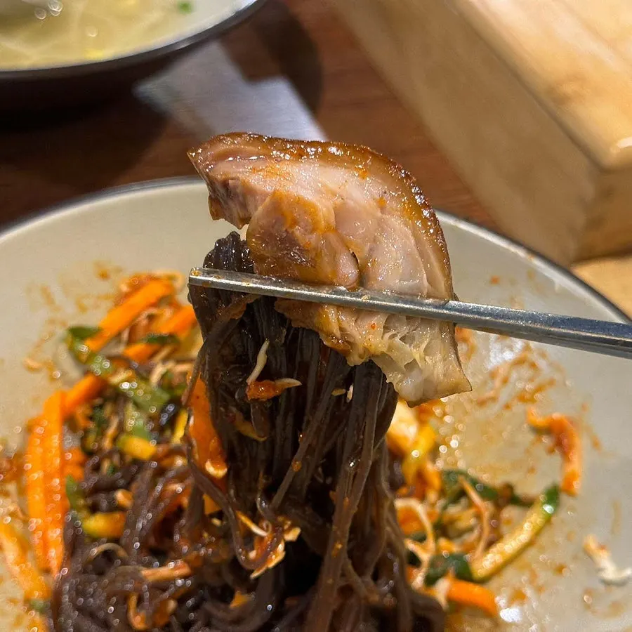 Fruit makguksu mixed with sauce