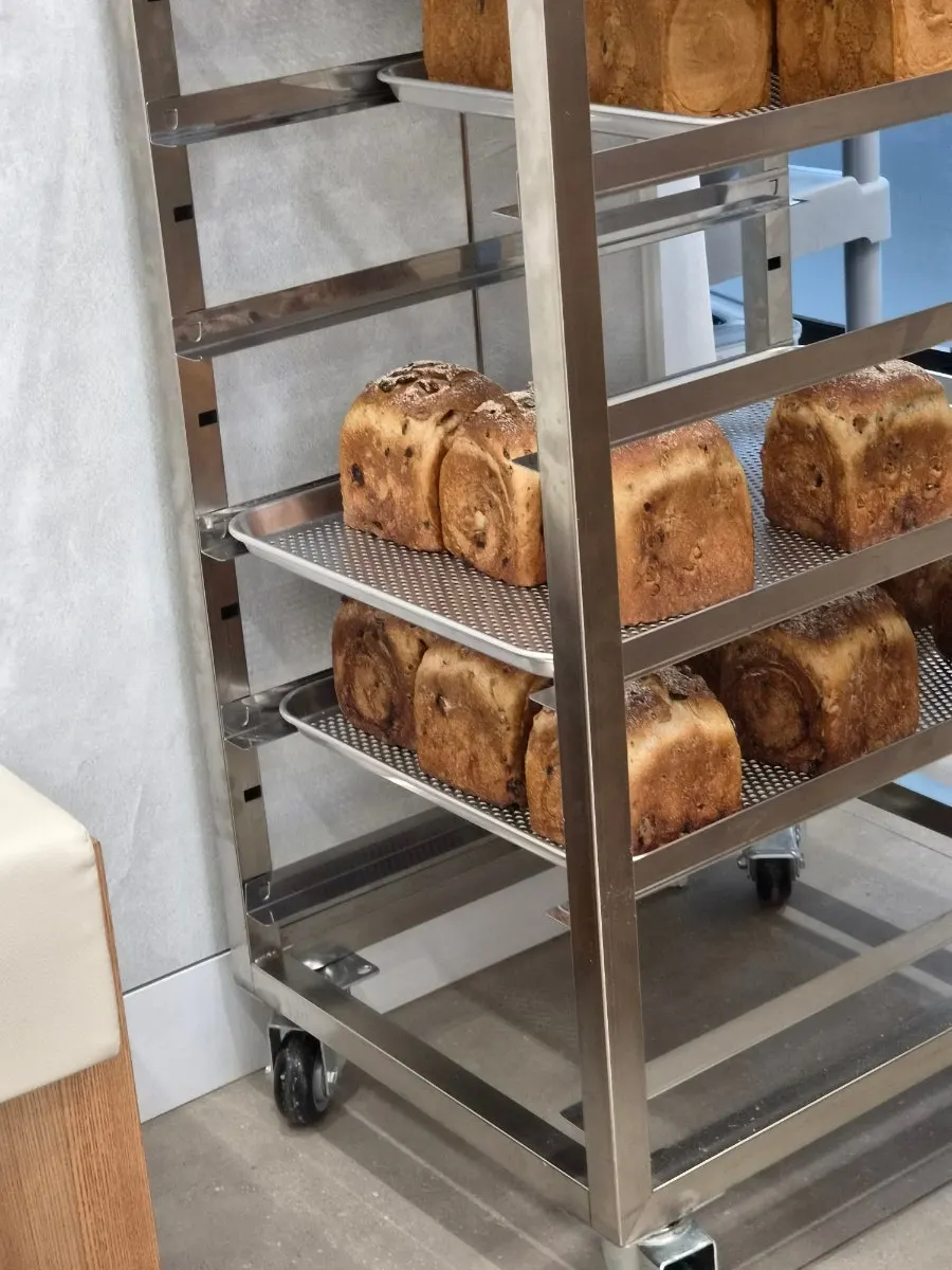 Various types of bread on the bakery display shelf