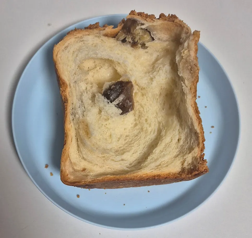 Cross-section of the hand-torn sobolo chestnut rice cake milk bread showing chestnuts