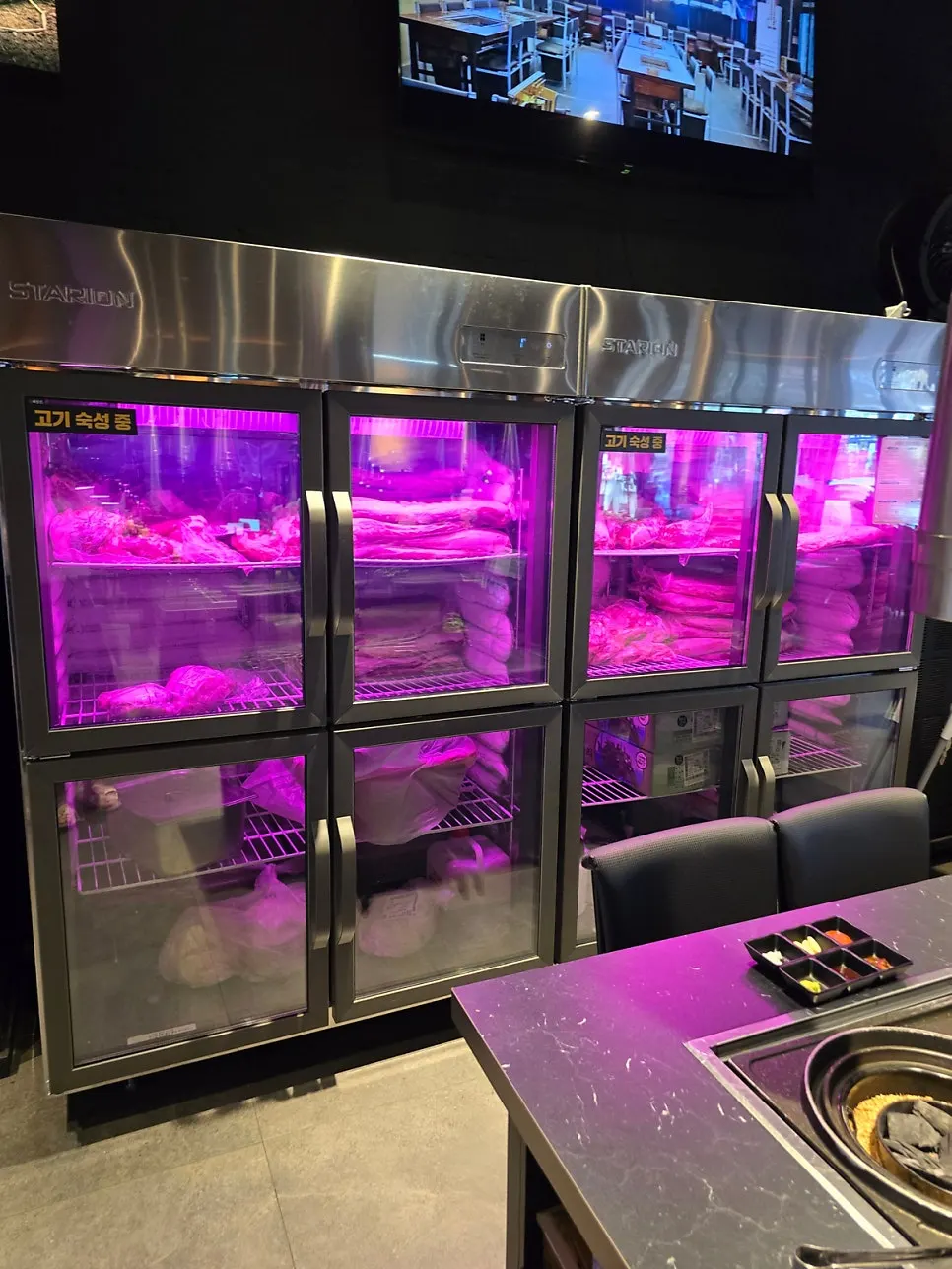 Meat aging in storage on one side of the restaurant