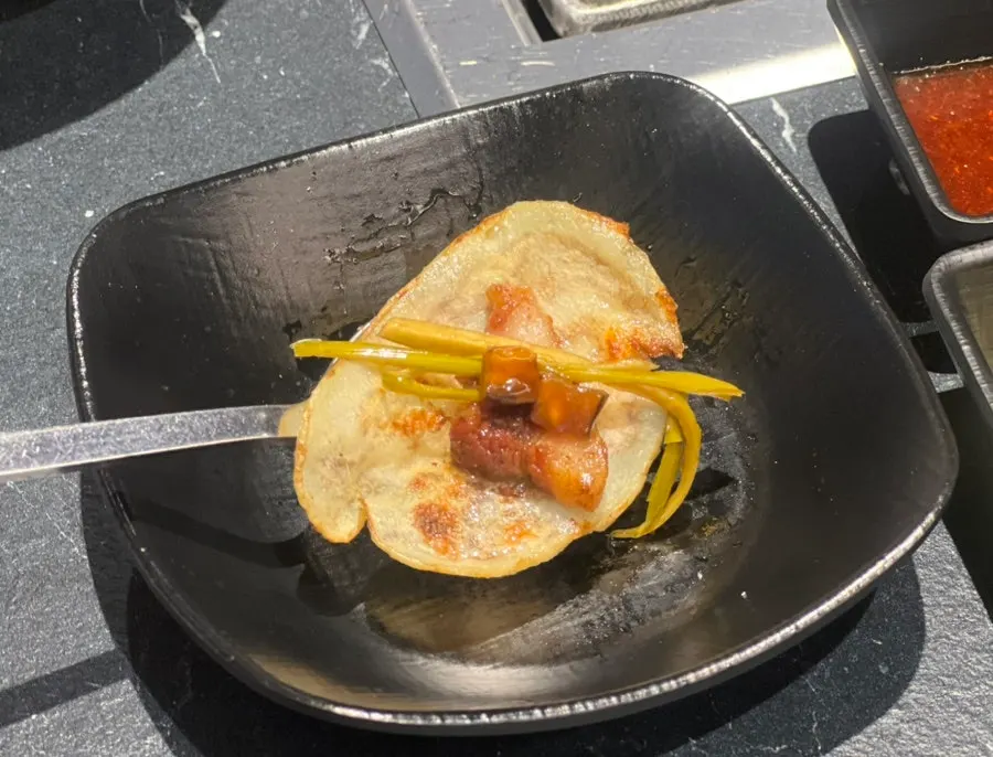 Wrap combo with sliced potato and garlic scapes