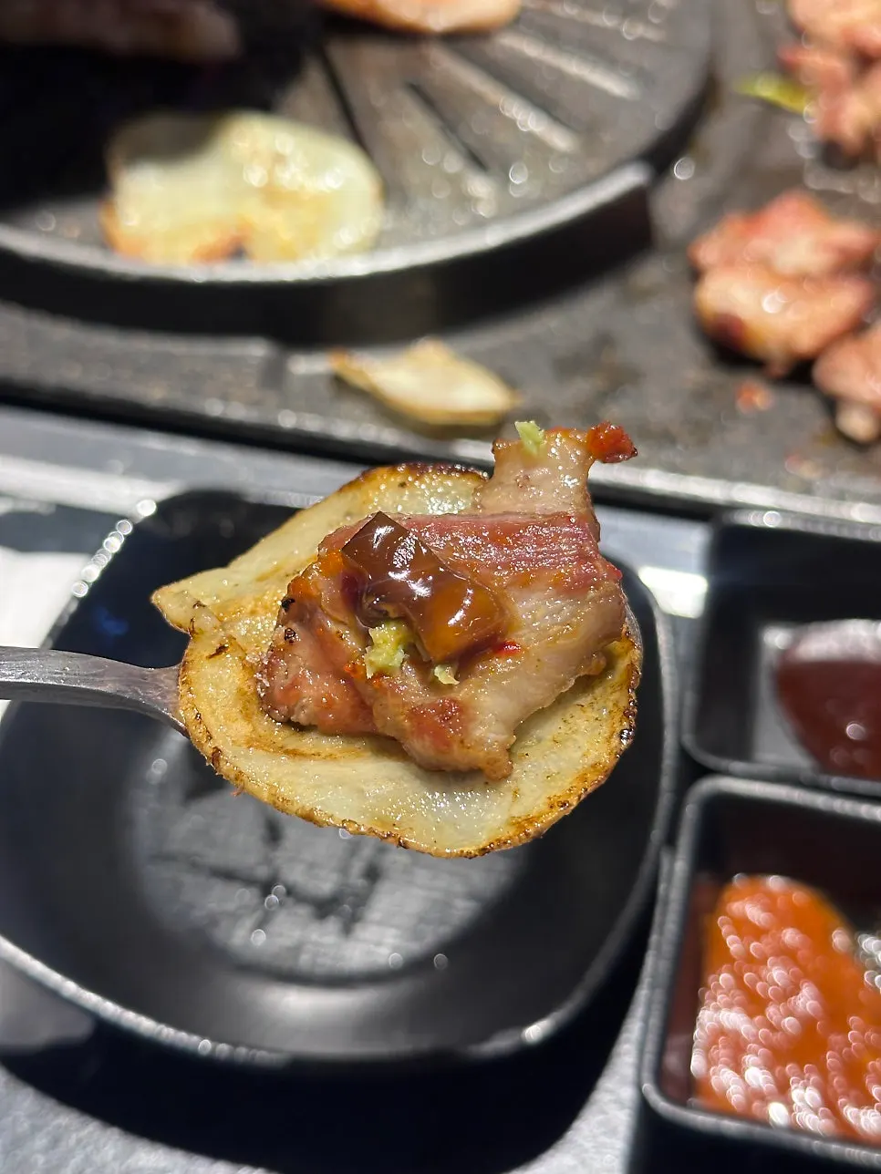A piece of grilled pork jowl from Cham Dwaejitgan