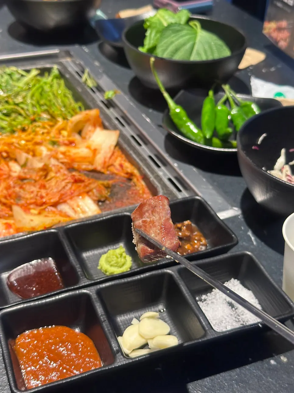 Table spread of black pork neck and soy sauce egg rice