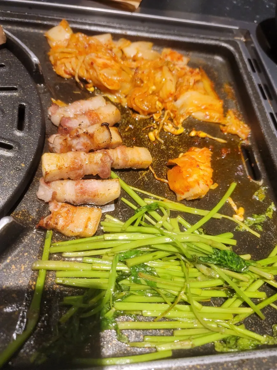 A piece of pork belly dipped in salt