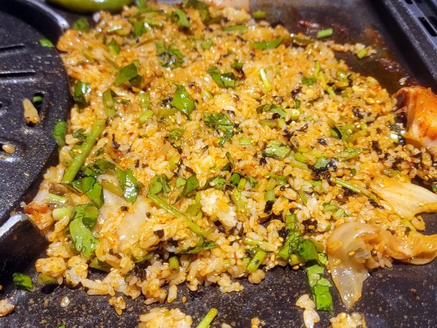 Fried rice spread flat and cooked on the grill