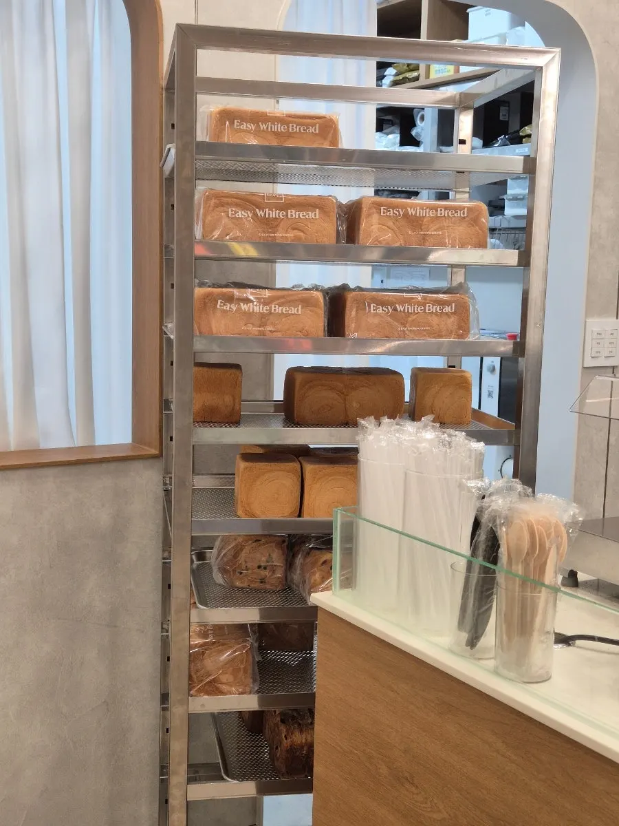 Packaged fresh milk bread displayed inside the shop