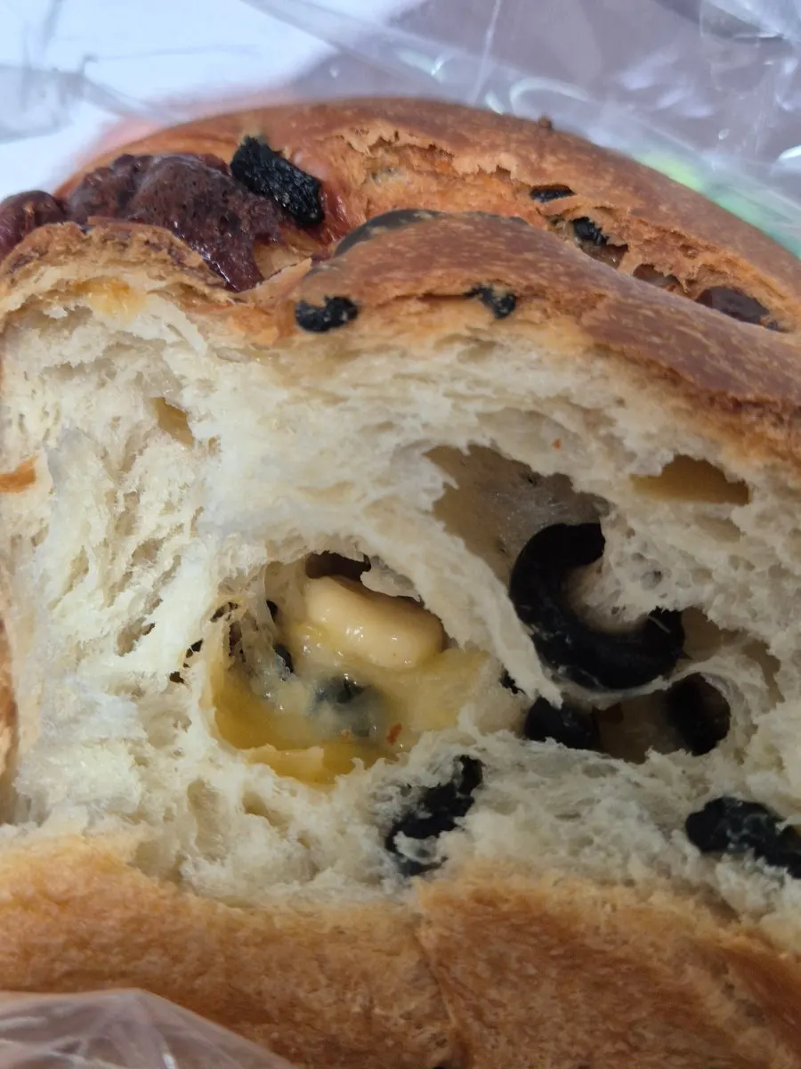 Cross-section of olive cheese fresh milk bread