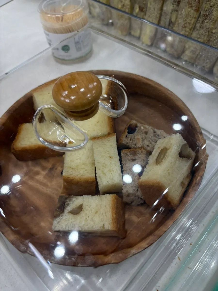 Sample corner with bread to taste near the counter