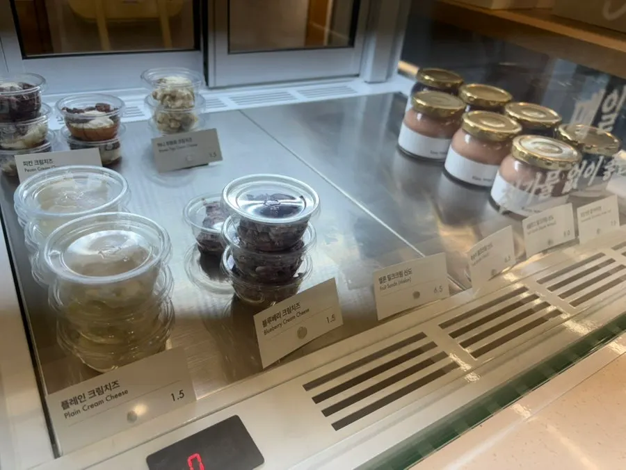 Handmade jams and cream cheese in the refrigerated showcase