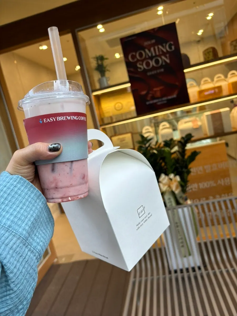 Two packed loaves of milk bread and a real strawberry latte