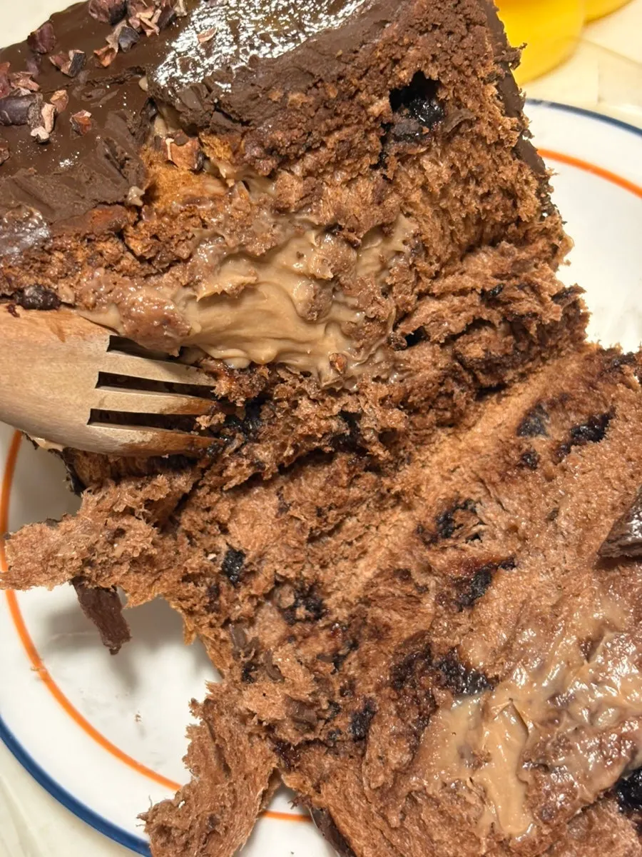A hand-torn piece of the chocolate milk bread