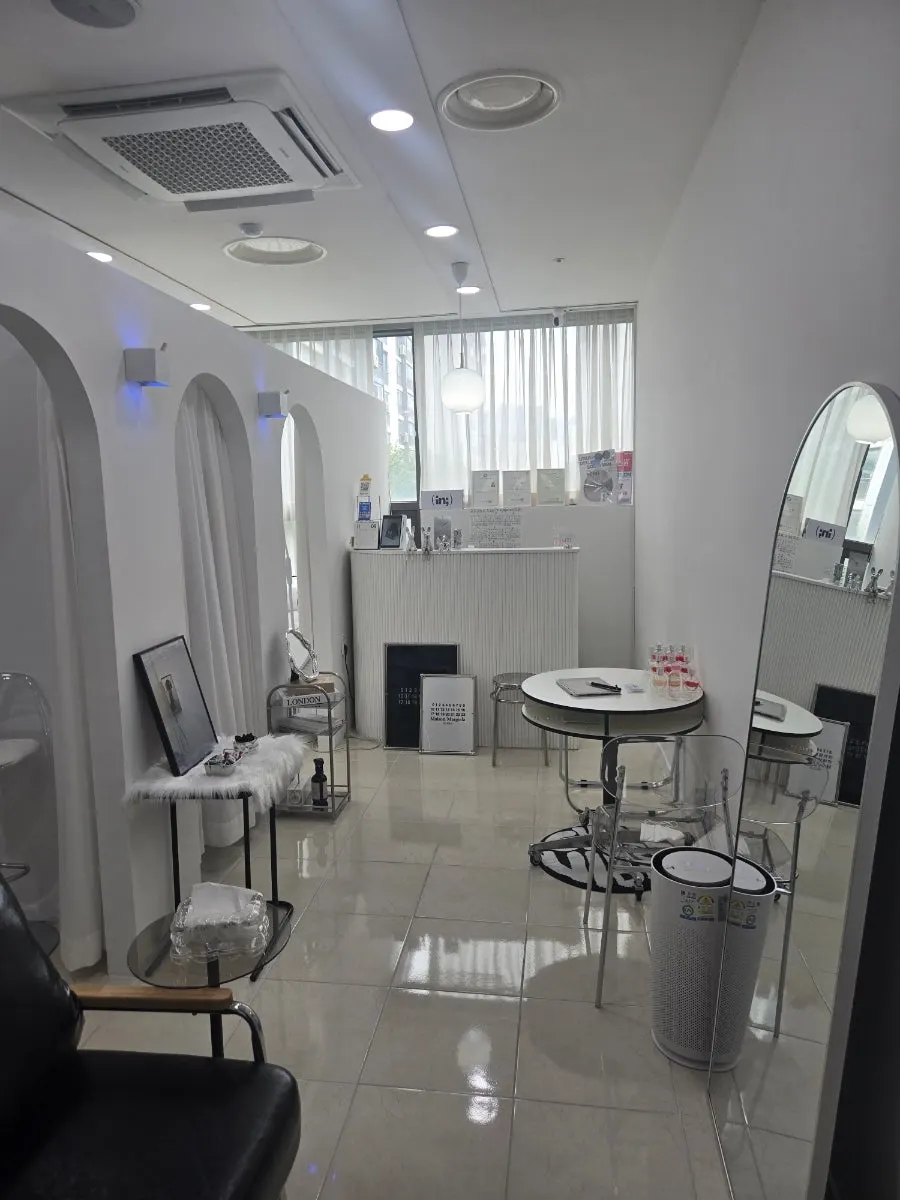 Entrance and white interior of Iniz Beauty